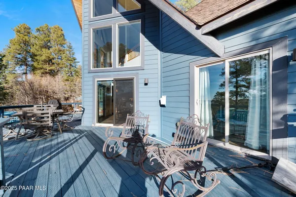 a view of a balcony with chairs
