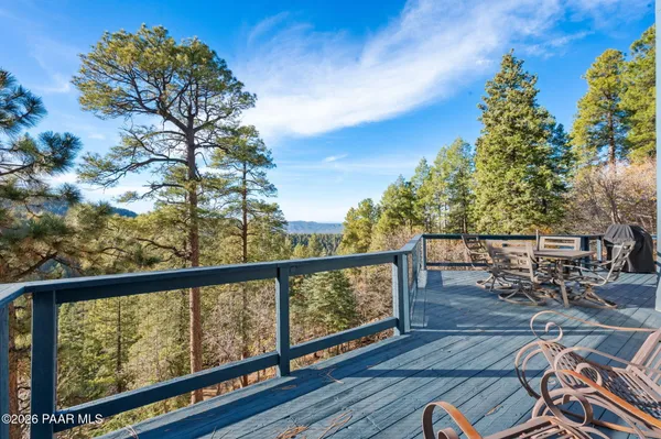 a view of a forest from a balcony