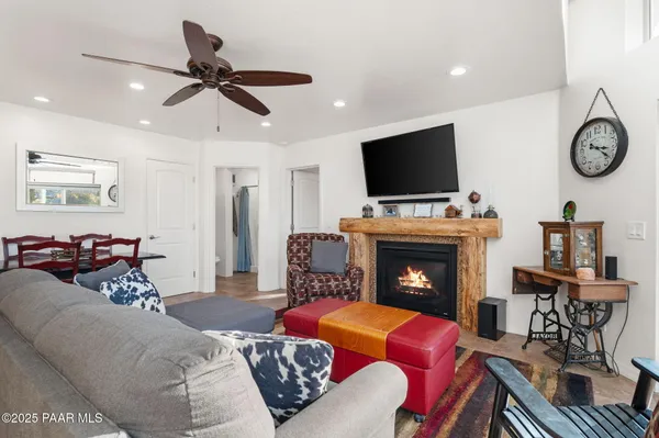 a kitchen with stainless steel appliances granite countertop a sink a stove a refrigerator a microwave a sink and a refrigerator