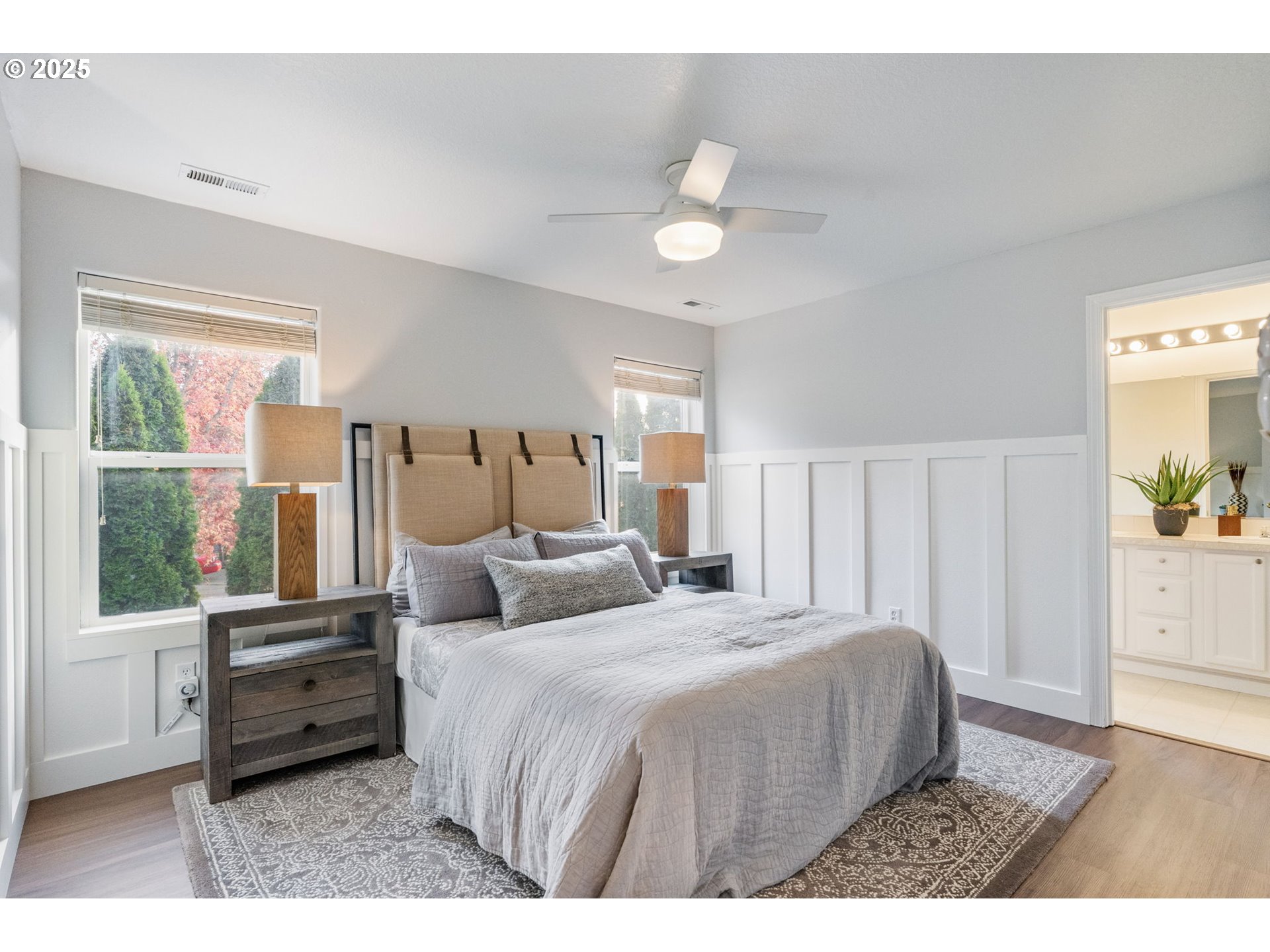 18186 Southwest Strathmoor Street Beaverton, OR 97007 - Photo 14 of 35 a bedroom with a bed a window and potted plant on the dresser
