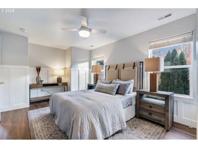 a bedroom with bed and large window