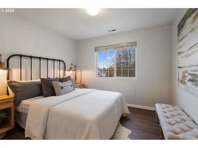 a bedroom with a bed and a window