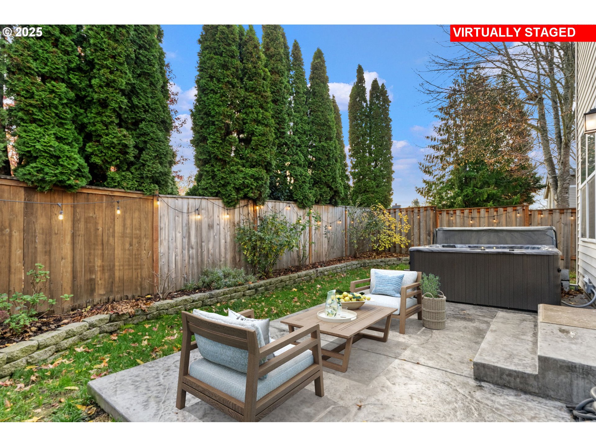 18186 Southwest Strathmoor Street Beaverton, OR 97007 - Photo 27 of 35 a backyard of a house with table and chairs