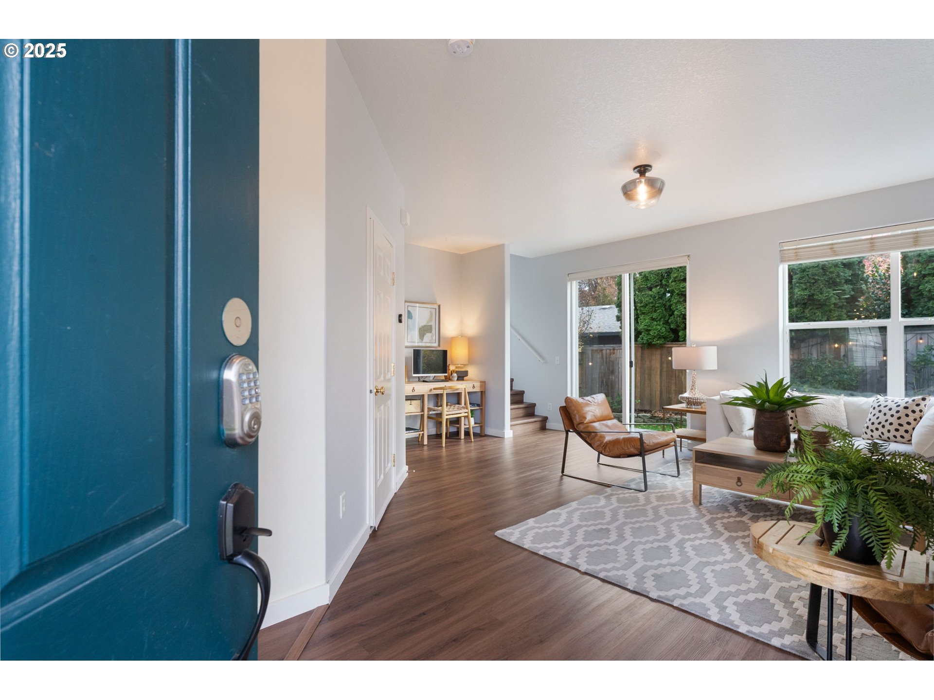 18186 Southwest Strathmoor Street Beaverton, OR 97007 - Photo 3 of 35 a living room with furniture and wooden floor
