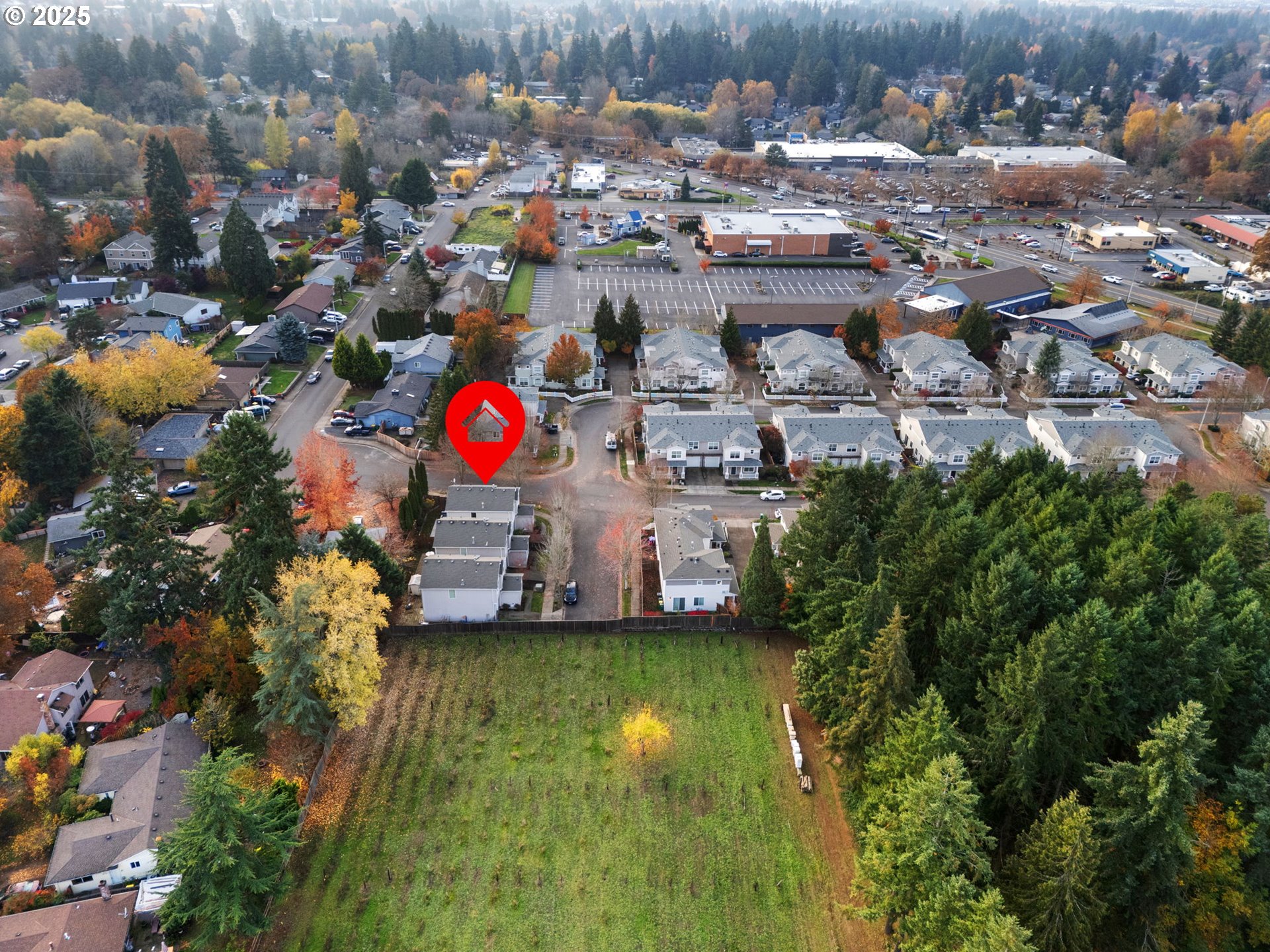 18186 Southwest Strathmoor Street Beaverton, OR 97007 - Photo 31 of 35 an aerial view of residential houses with outdoor space and swimming pool