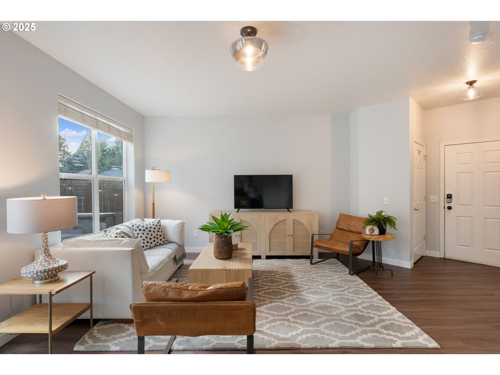 18186 Southwest Strathmoor Street Beaverton, OR 97007 - Photo 6 of 35 a living room with furniture and wooden floor