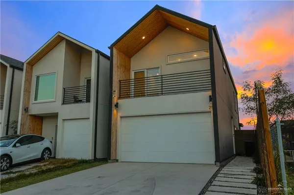 a front view of a house with a garage