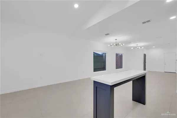 a kitchen with a sink and a refrigerator