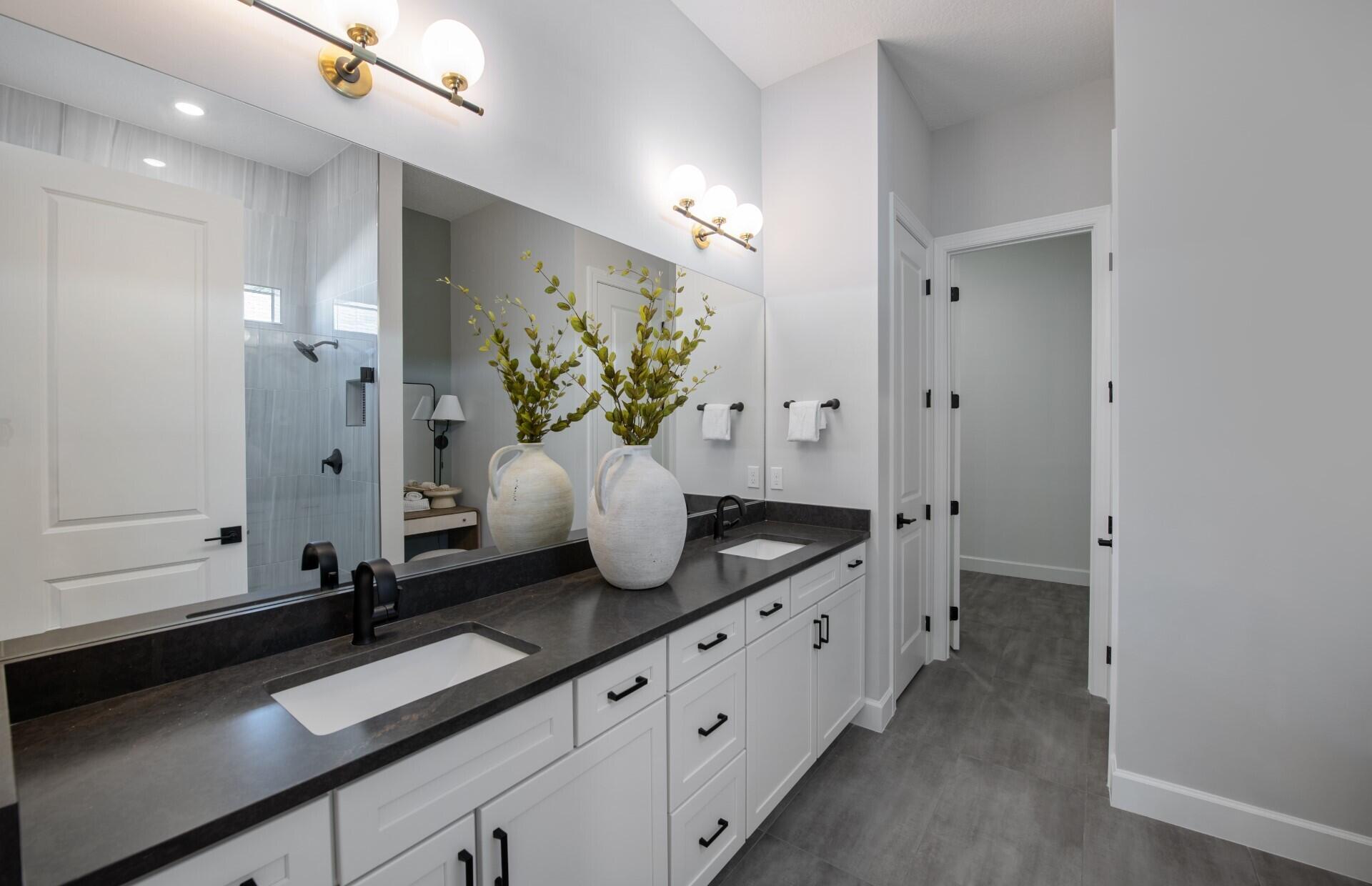 10231 Southwest Highpointe Drive, Unit ASHBY 281 Stuart, FL 34997 - Photo 13 of 33 a bath room with sink and mirror