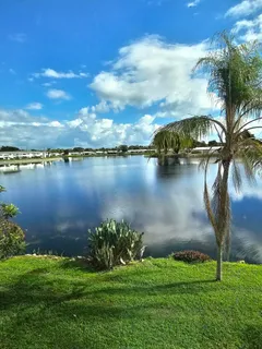 a view of a lake with a big yard