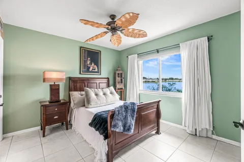 a room with lots of furniture and a chandelier