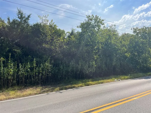 a view of a swimming pool with a yard