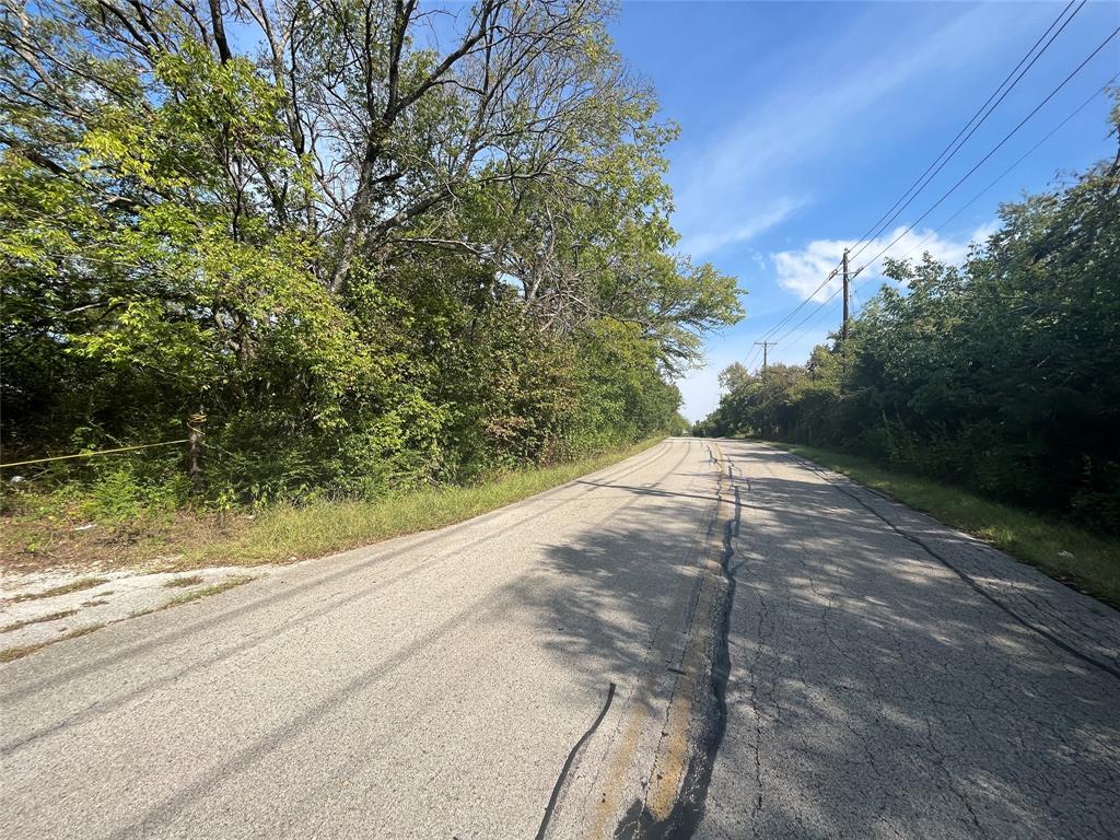 215 North Houston School Road Lancaster, TX 75146 - Photo 9 of 13 a view of a yard with a tree