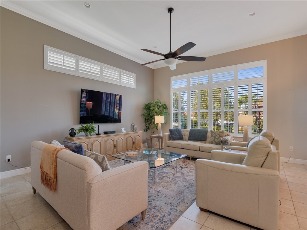 8260 Halbert Lane Vero Beach, FL 32968 - Photo 14 of 36 a living room with furniture and a chandelier