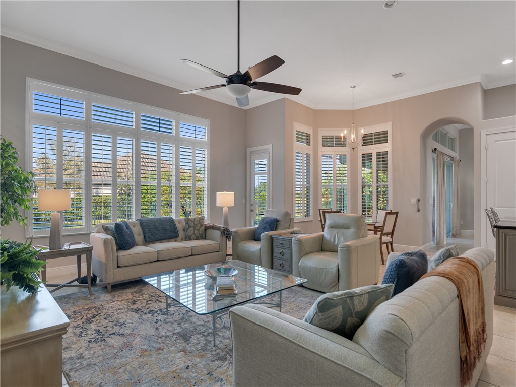 8260 Halbert Lane Vero Beach, FL 32968 - Photo 15 of 36 a living room with furniture and a large window