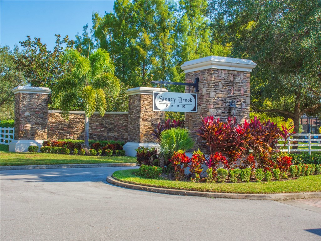 8260 Halbert Lane Vero Beach, FL 32968 - Photo 36 of 36 a front view of a house with a yard and outdoor seating