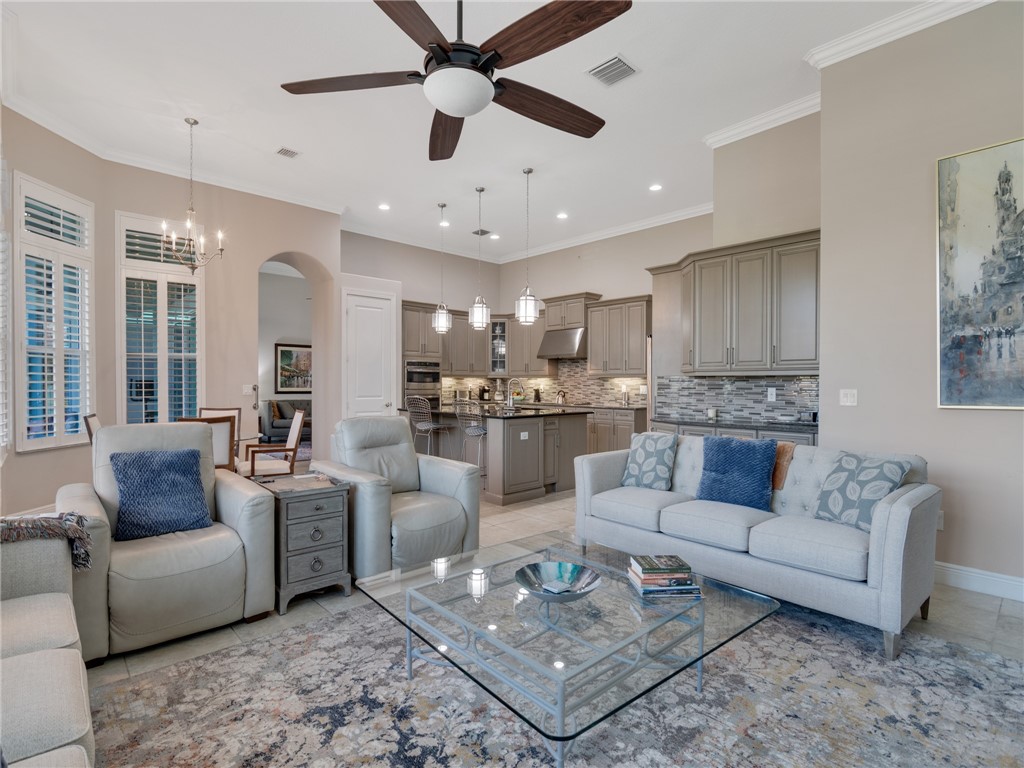 8260 Halbert Lane Vero Beach, FL 32968 - Photo 5 of 36 a living room with furniture and kitchen view