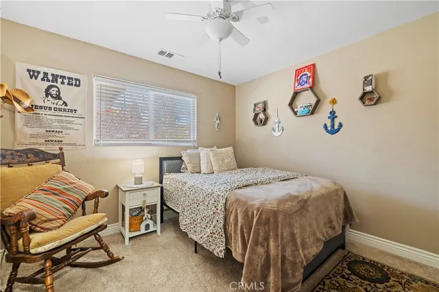 a bedroom with furniture and a window