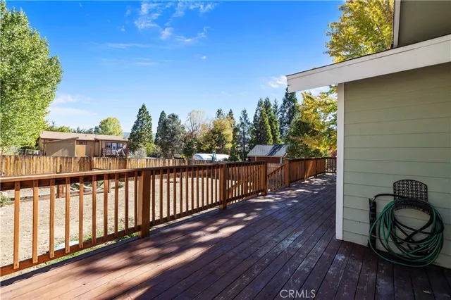 a view of a house with a yard covered in snow