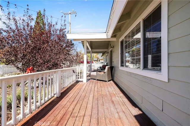 a view of a balcony with wooden floor