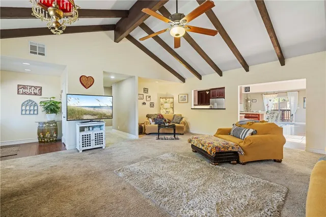 a view of a livingroom with furniture and windows