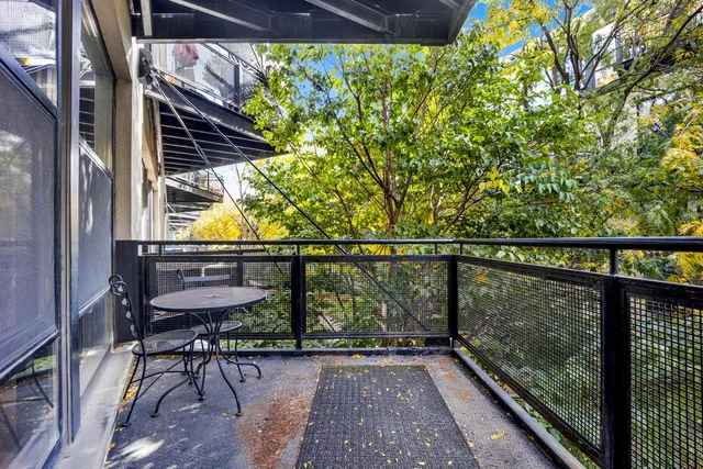a view of a balcony with chairs