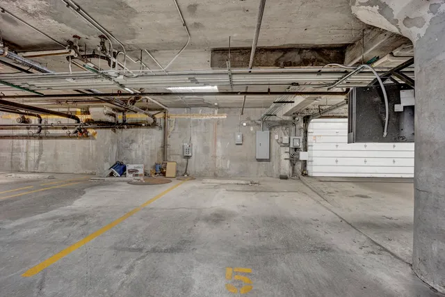 a view of empty room with wooden walls