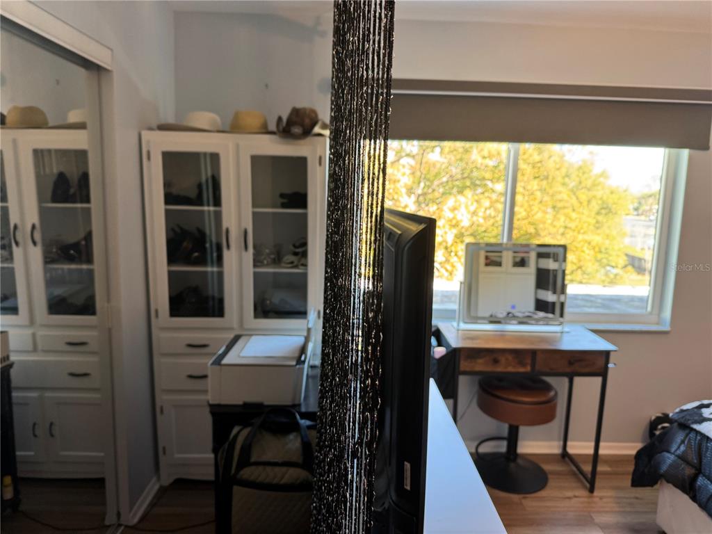 1775 Cupecoy Circle, Unit 4 Lutz, FL 33558 - Photo 24 of 33 a view of a workspace with furniture and a window