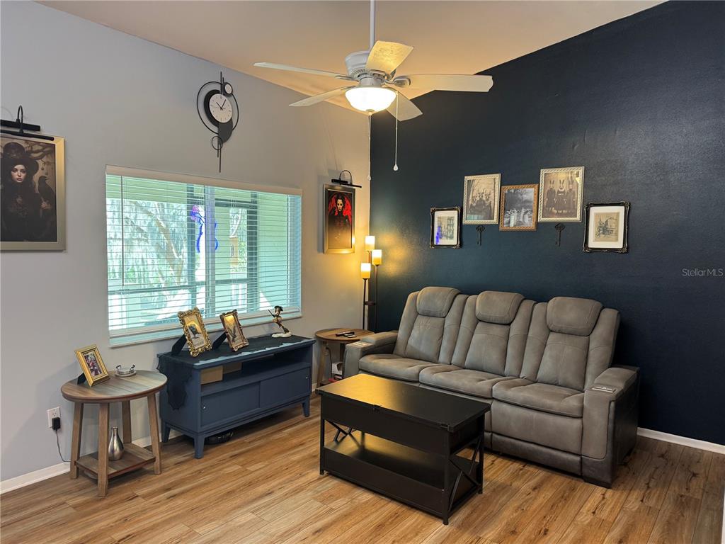 1775 Cupecoy Circle, Unit 4 Lutz, FL 33558 - Photo 6 of 33 a living room with furniture and a large window