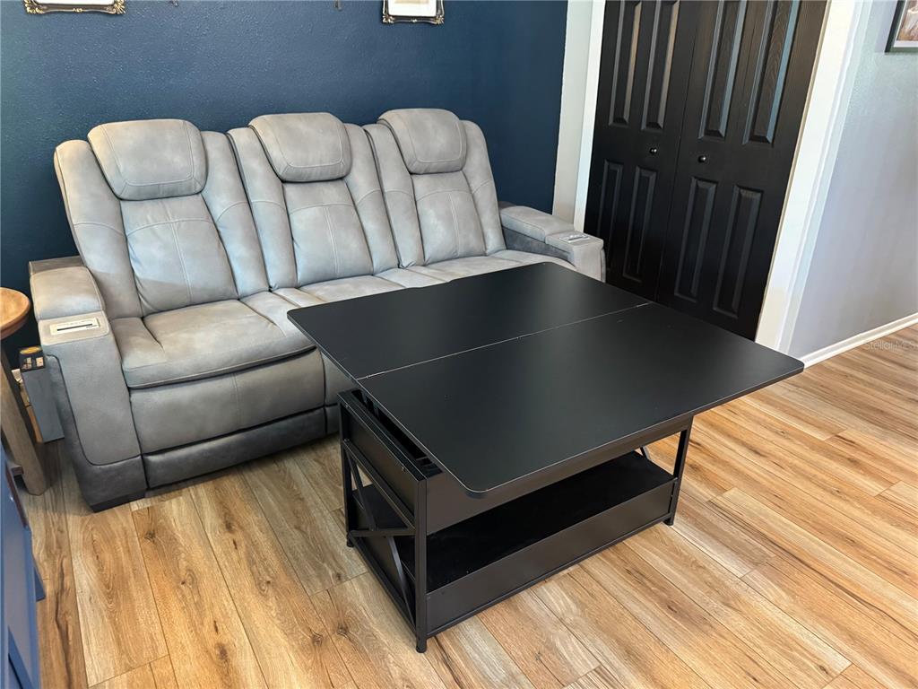 1775 Cupecoy Circle, Unit 4 Lutz, FL 33558 - Photo 7 of 33 a living room with furniture