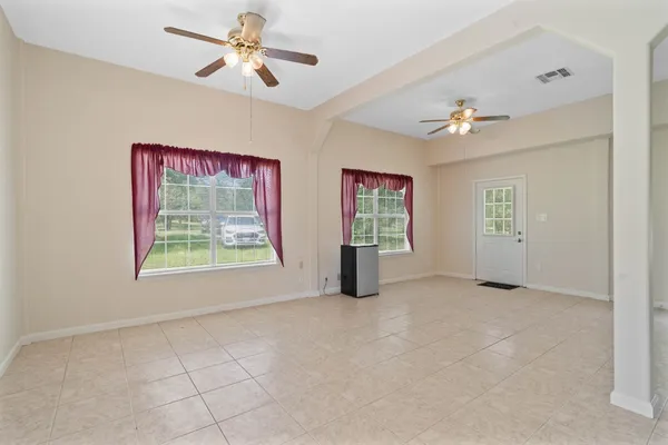 a view of a kitchen with a sink and a refrigerator