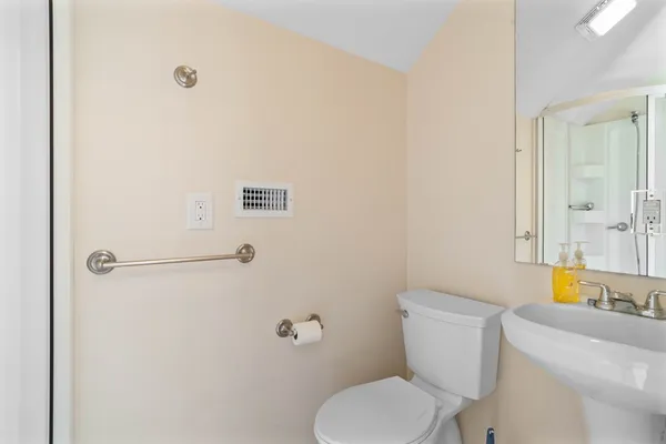 an empty room with closet and windows