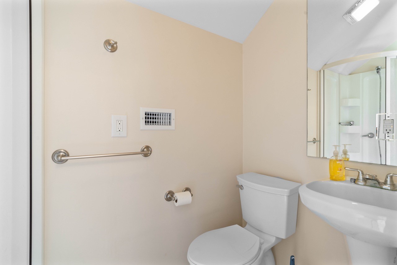1019 Deer Field Court Weimar, TX 78962 - Photo 26 of 50 a white toilet sitting next to a bathroom sink