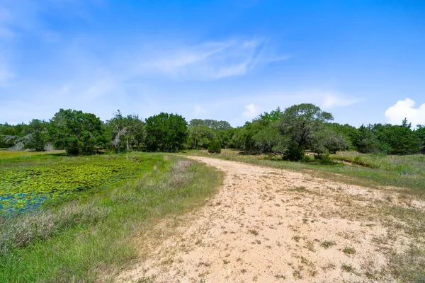 a view of a green field with clear sky