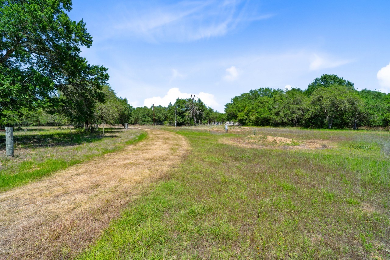 1019 Deer Field Court Weimar, TX 78962 - Photo 38 of 50 a view of a field with trees in the background