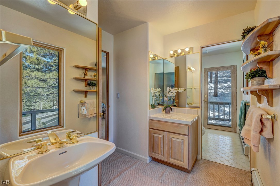 868 Tyner Way Incline Village, NV 89451 - Photo 18 of 25 a bathroom with a sink double vanity and a mirror