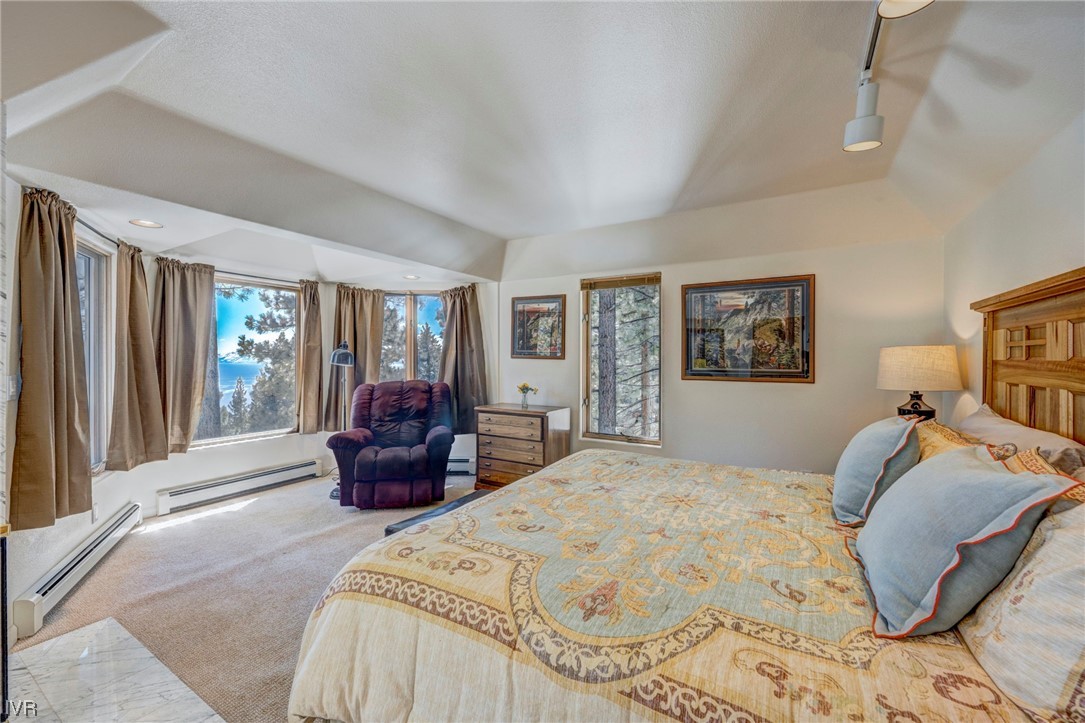 868 Tyner Way Incline Village, NV 89451 - Photo 20 of 25 a bedroom with a large bed and a large window