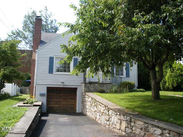 99 Ridgely Avenue Fairfield, CT 06825 - Photo 1 of 1 a front view of a house with garden
