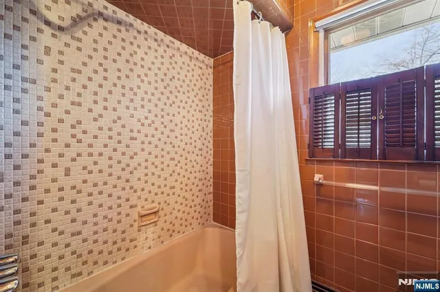 a bathroom with a shower curtain