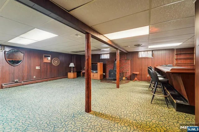 a view of a livingroom with furniture and a rug