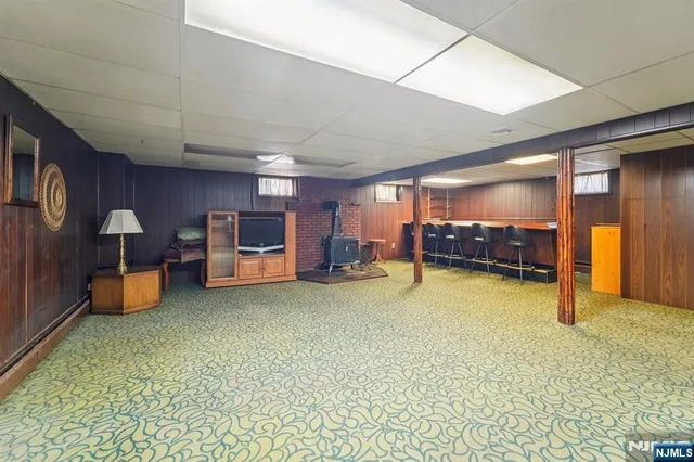 a view of a livingroom with a furniture and a refrigerator