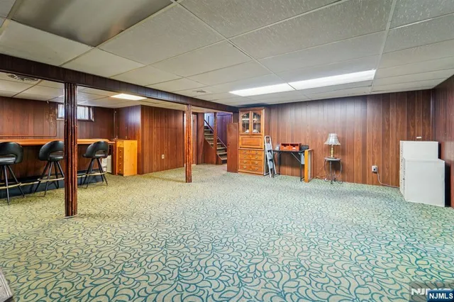 a room with chairs and table in it