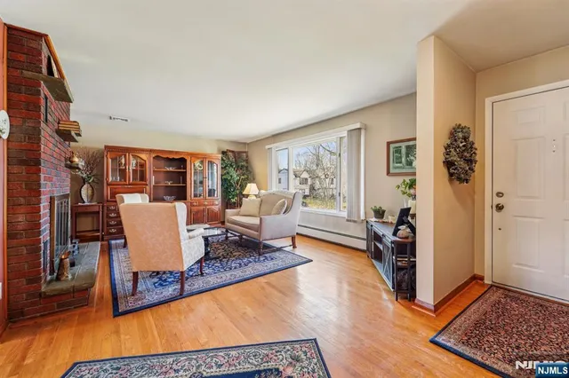 a living room with furniture a rug and a window