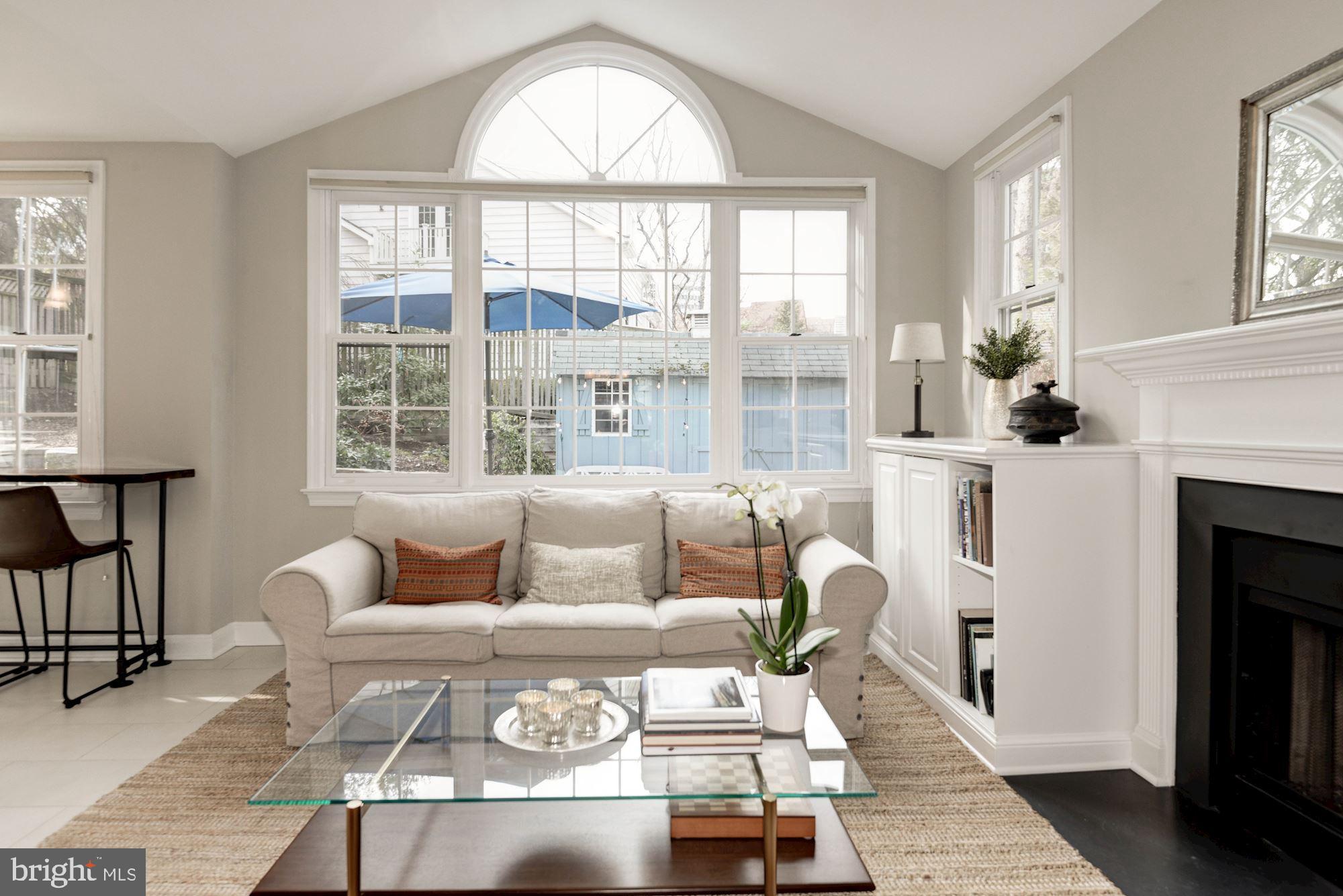 7504 Tarrytown Road Chevy Chase, MD 20815 - Photo 26 of 66 Great room with vaulted ceilings and fireplace