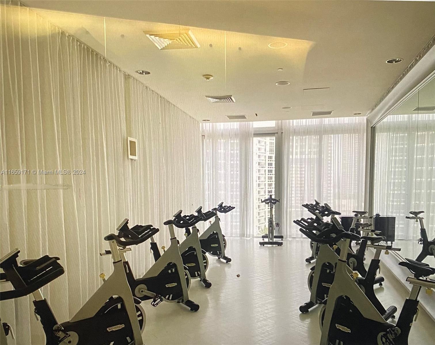 475 Brickell Avenue, Unit 4812 Miami, FL 33131 - Photo 16 of 20 a view of a room with gym equipment
