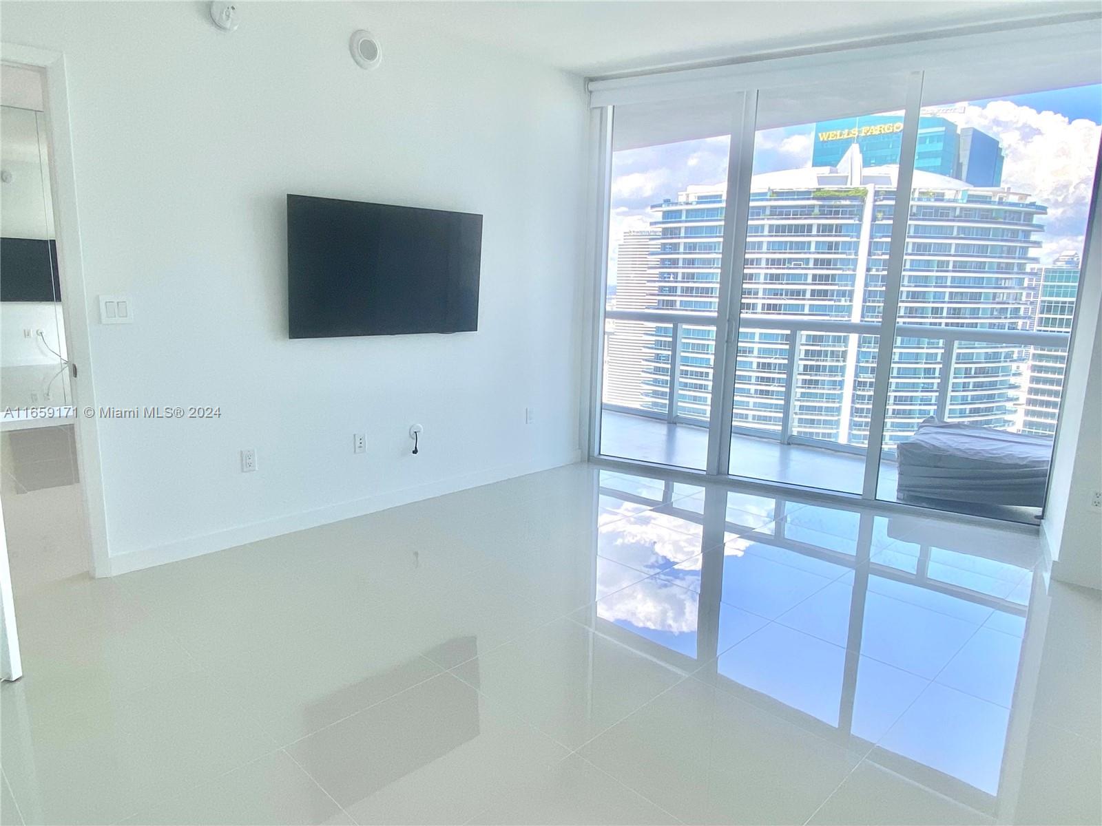 475 Brickell Avenue, Unit 4812 Miami, FL 33131 - Photo 4 of 20 a view of a living room and natural light