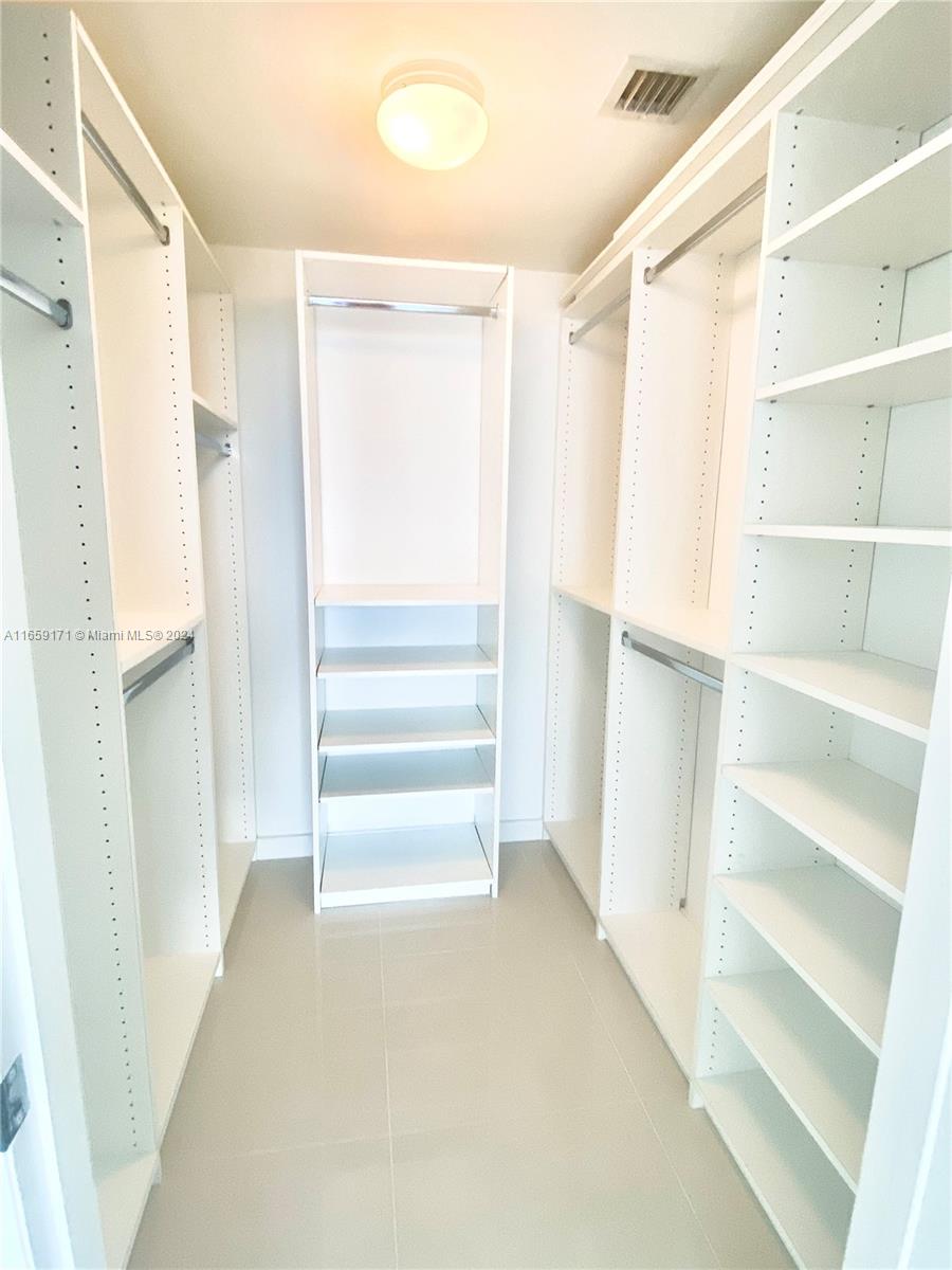 475 Brickell Avenue, Unit 4812 Miami, FL 33131 - Photo 7 of 20 a view of closet area with empty racks