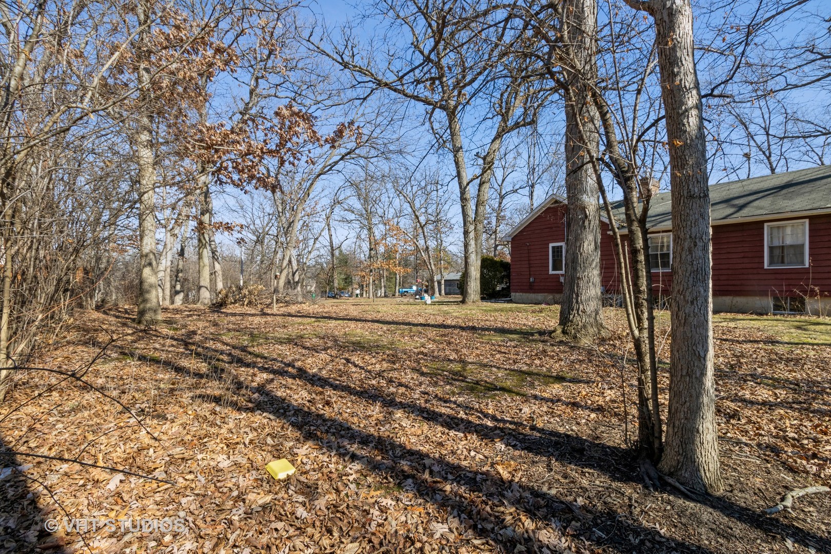 27W513 Manchester Road Winfield, IL 60190 - Photo 3 of 9 a view of a yard with a large tree