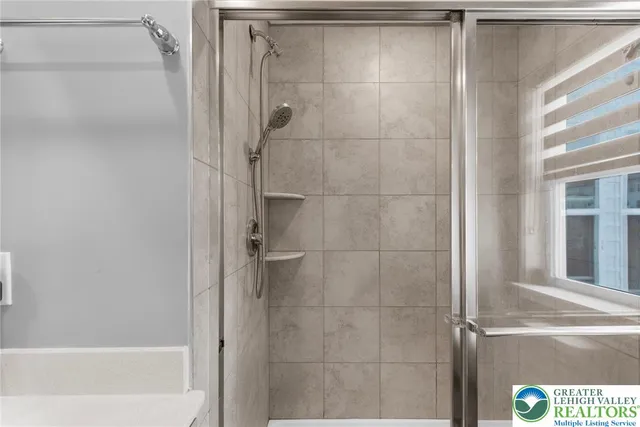 a bathroom with a glass shower door