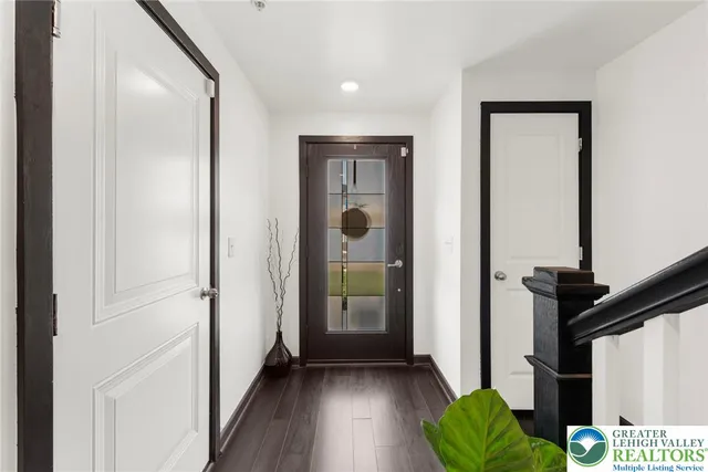 a view of hallway with furniture and a window